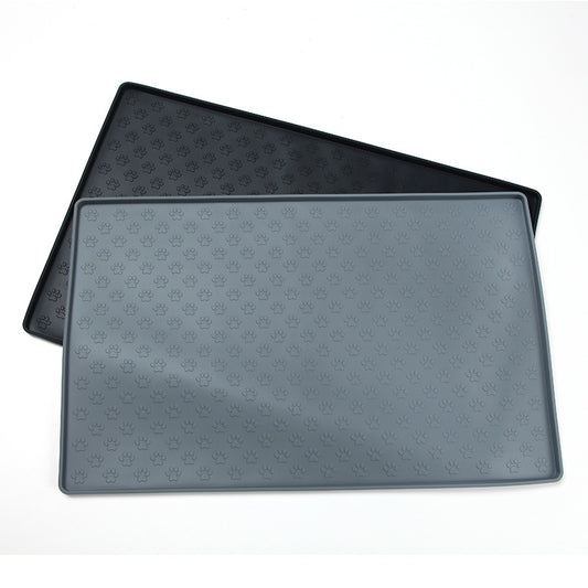 Two black pet mats with paw print pattern on a white background
